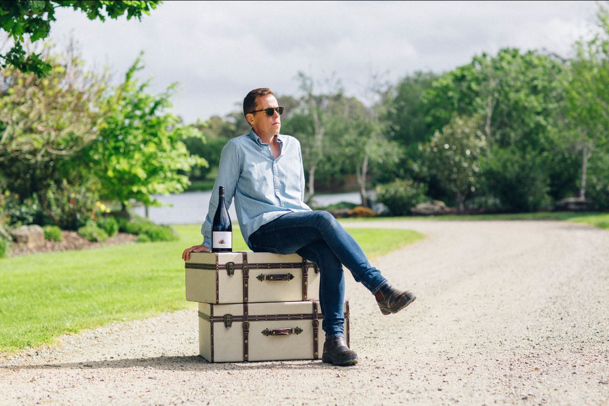 Winemaker with wine on the box